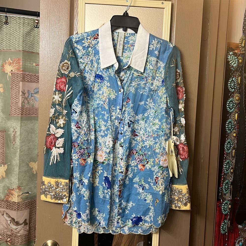 Never worn long sleeve jacket. Very elegant